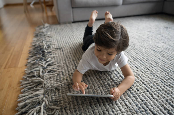 Girl lying on rug | Battle Creek Tile & Mosaic