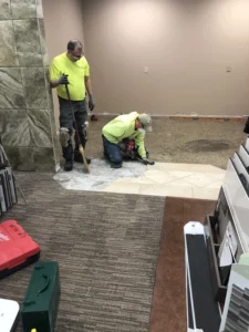 team installation Team Installing floor | Battle Creek Tile & Mosaic